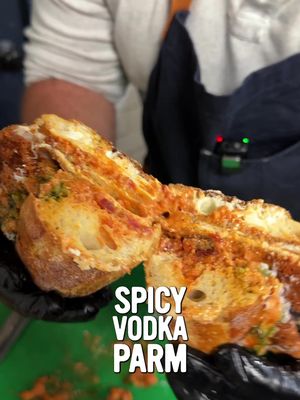 Chicken Parm: Crispy Chicken Topped with Spicy Vodka Sauce, Sliced Mozzarella, Shaved Parm, and a Drizzle of Nut-free Basil Pesto