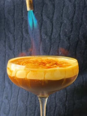 CRÈME BRÛLÉE ESPRESSO MARTINI! YESSIR! - For the Espresso Martini: (Per drink) 2 oz vodka 1 oz freshly brewed espresso (cooled down) 1/2 oz coffee liqouer 1/2 oz simple syrup For the Whipped Creme Anglaise: (Enough for 6-8 drinks) 2 cups heavy cream 1 vanilla pod 6 eggs 1/2 cup granulated sugar Other: 1/4 cup granulated sugar, for bruleeing Coffee beans, for garnish #espresso #cremebrulee #Recipe #espressomartini 