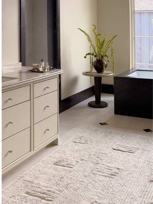 The Monterrey Collection was made to soften even the hardest spaces. This bathroom's hard lines take center stage, so we brought in a little texture to take the edge off. #BrigetteRomanekxLoloi @Brigette Romanek  Rug: Monterrey MRY-03 Ivory/Natural