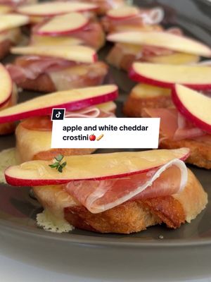Easy app alert! 🍎🥖 Save this apple and white cheddar crostini recipe for when you need a quick snack at your next get-together. We sliced up in-season apples, white cheddar and a crusty baguette with the @wusthof Gourmet 10-piece knife block set for a crowd-pleasing app in minutes. Be sure to add this triple-riveted, full-tang knife block set to your wedding registry for effortless entertaining and daily meal prep.  Recipe 👇🏼 1 baguette ¼ cup extra-virgin olive oil Kosher salt Freshly ground black pepper 6 oz. sharp white cheddar cheese, thinly sliced 4 oz. thinly sliced prosciutto 1 small apple, cored and thinly sliced 2 tbsp. honey 2 tbsp. fresh thyme leaves 1. Preheat the oven to 375°F. 2. Cut 24 ⅓-inch thick slices from the baguette, and lay them on a baking sheet. Brush the tops with the olive oil and lightly season with salt and pepper. 3. Bake on the middle rack in the oven for 10 minutes. Remove the pan from the oven, and top each crostini with a piece of cheese. Return the pan to the oven and bake until the cheese is melty, about 2 minutes. 4. Place the crostini on a serving platter. Drape a small piece of prosciutto onto each crostini, and top each with an apple slice. Drizzle the crostini with honey and garnish with thyme leaves. #Fall #appetizer #snack #crostinirecipe #crostini 