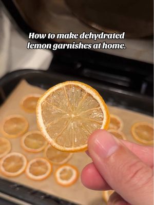 How to make dehydrated lemon garnishes at home.  Bake in the oven to the lowest temperature (for my oven it's 170ºF) until completely dry, approximately 4 to 5 hours #ninjaairfryer #dehydratedlemon #cocktailgarnish 