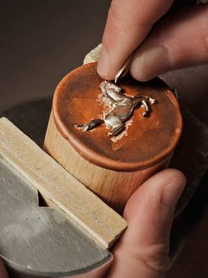 Artistic expression  Vacheron Constantin presents the Métiers d'Art The Legend of the Chinese Zodiac – Year of the Horse pieces, which give free rein to the artistry of the Maison's artisans.  To create the horse on the dial, the master engraver sculpts 18K white or pink gold, while creating fine details such as the horse's mane and tail. The use of relief engraving for the applied motif creates visual depth and enhances the impression of dynamic movement. To create the dial background, two enamelling techniques are used: multi-coloured gradient grand feu enamel which changes from a lighter shade in the centre to slightly darker at the edges, and miniature-painted enamel for the foliage. The colour is applied in layers with a very fine brush and the dial plate is then fired at more than 800°C – an operation repeated as many times as necessary to cover the full range of colours in the design and requiring up to two weeks of work.  #VacheronConstantin #TheQuest #VC270
