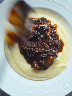 Braised Oxtail and Mushrooms with Mashed Potatoes - Another Day In Paradise  I rarely cook stewed meat dishes - I don’t know if it is a lack of patience or not really enjoying having free time on my hands but it isn’t about not liking them. I love this meal enough to change my ways when the weather gets cold.  You can find the full recipe on my newsletter - link below 🫶🫶 https://open.substack.com/pub/kitchenstudio/p/braised-oxtail-with-mushrooms-and?r=57lfps&utm_medium=ios