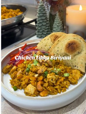 Ad Chicken tikka biryani with curried cashews & sticky mango slaw   #Ad a nice and simple Friday Fakeaway, with @Asda UK 💚you get all the great flavours of a takeaway but without splurging or breaking the bank!    Serves 4 Less than £10.00   - 60g cashews - 1 tbsp + ¼ tsp olive or vegetable oil - 4 ½ tsp Cook by Asda Tikka Curry Powder - 2 peppers, any colour - 1 small-medium loose red onion - 1 ½ tbsp Asda Mango Chutney - ½ loose lemon, juiced - 300g Asda Chicken Breast Portions - 4-5 spring onions, finely sliced - 2 x 250g Chip Shop Curry Micro Rice - 4 mini garlic & coriander naans 1) Mix the cashews with the ¼ tsp oil, then sprinkle over ½ tsp curry powder, a little salt and pepper. Air fry for 5-7 mins at 170C (or roast for 5-7 mins at 220C/200C fan in the oven, until golden brown.   2) Meanwhile, prep the slaw. Deseed and thinly slice the peppers, thinly slice the red onion. In a bowl whisk the mango chutney with enough lemon juice to a sweet-sour dressing.   3) Cut the chicken breast chunks into small, bite-size pieces. Heat 1 tbsp oil in a non-stick frying pan then fry the chicken for 4-5 mins, stirring until golden brown and almost cooked through. Stir in the 1 tbsp tikka curry powder for 1 min.   4) Add most of the chopped spring onions and the rice sachets, crumbled up, with a splash of water. Keep frying, breaking up the rice, until everything is hot – add a splash more water if it looks dry.   5) Heat the naans following pack instructions. At the last minute mix the mango dressing through the peppers and onions   6) Check the chicken is cooked through, then divide the chicken biryani between bowls and scatter over the rest of the spring onions, plus the crunchy tikka cashews, chopped or bashed to smaller pieces. Serve with sticky mango slaw, warm naan breads and extra mango chutney. #fyp #chickentikka #biriyani #ASDA  