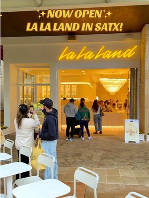San Antonio!! @La La Land Kind Cafe has officially opened at La Cantera! This bright and cheerful café is known for its amazing craft drinks, cozy aesthetic, and fun seasonal specials that pop up throughout the year! ☕💛☁️ They’re famous for creative lattes, matcha, lavender + strawberry drinks, iced coolers, toasts, and tons of Instagram-worthy options. 🌿🍵✨ 🌟 Soft Open: happening now through 12/6 ➡️ 50% off all drinks during soft open 🎉 Grand Opening Party (12/6): 🕗 8am–2pm celebration (then open until 7pm) ➡️ 50% off all drinks + toast 🎁 First 300 guests get free La La Land gifts! 📍 15900 La Cantera Pkwy, Ste 20100, San Antonio, TX 78256 #lalaland #coffeeshop #sanantonio #sanantoniotexas #fyp 