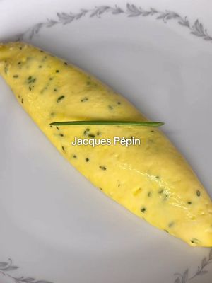 How to Make Jacques Pépin’s Classic French Omelette 🥚🇫🇷🥚🇫🇷 INGREDIENTS: 4 large eggs (for a 24 cm pan) 2 tbsp butter 1/4 bunch chives fine kosher/sea salt INSTRUCTIONS: 1. Crack your eggs into a small bowl, and whisk your eggs vigorously with a fork. When the eggs are well mixed and homogeneous, strain them through a fine mesh strainer into another container. 2. Finely chop your chives - should yield about 1 tbsp of chopped chives. Season your eggs with a good pinch of salt, and a pinch of chives. 3. In a non-stick pan, heat your butter over medium-high heat. When the butter is fully melted, and starts to foam up, add your eggs to your pan. Immediately turn your heat down to medium-low. 4. With a rubber spatula, vigorously scramble your eggs, moving your spatula in a circular motion around the pan. Simultaneously shake your pan, which will allow you to agitate your eggs even more effectively. You are looking for many very small curds to form. 5. Once the eggs have started to set, and the edges of your eggs are cooked, leave your omelette without touching it, to continue cooking 1-2 more minutes.  6. Once the eggs are 3/4 of the way cooked, and the top of your egg is slightly wet to the touch, you can start rolling your omelette.  7. With the handle of the pan pointed towards you, start working your spatula under the eggs on the half of the pan closest to you, folding it over into a half-football shape. Once this is done, start working the omelette down towards the opposite end of the pan, either by nudging it with your spatula, or by bumping the pan with the handle (like chef Pépin does). Gravity is also helpful during this step. As you do this, the un-folded part of the omelette opposite to the handle should start working its way up the wall of the pan, and eventually start to fold over to create the other half of your "football". Use your spatula (or your hand) to shape the omelette if needed. 8. Get a warm plate ready. Push your omelette right to the edge of the pan opposite the handle, and in one swift motion, flip it onto your plate. Your omelette will likely lose its shape during this transfer, so using spoons, a clean towel (or your hands), re-shape it. Rub with a small knob of butter, top with a chive baton and enjoy! #classic #french #omelette #homecooking #Recipe 