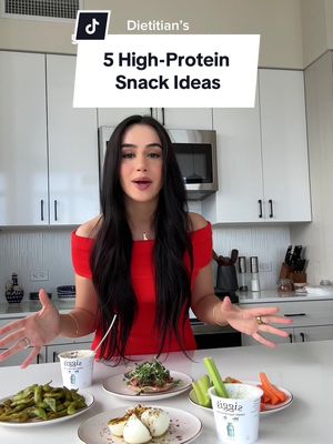 Here are 5 high-protein snack ideas to keep you full, satisfied, and energized through your day 🤍💪 2. Smoked Salmon Toast Toasted sandwich thins + chive cream cheese + smoked salmon (I love Ducktrap cracked pepper & garlic).  4. 4. Roasted Edamame Toss in olive oil, smoked paprika, and sea salt, then roast until crispy.  6. 6. High-Protein Ranch Dip Mix Siggi’s plain skyr with Trader Joe’s Ranch seasoning. Pair with celery and carrots for the crunch.  8. 8. Za’atar Eggs Hard-boiled eggs drizzled with extra-virgin olive oil and topped with za’atar, salt, and crushed red pepper.  10. 10. PB Choc Skyr Cup 1 cup Siggi’s plain skyr + 1 tbsp PB2. Top with 1 tbsp melted dark chocolate and flaky salt. Freeze until the chocolate hardens… thank me later.  Which one are you trying first? 😋🥄