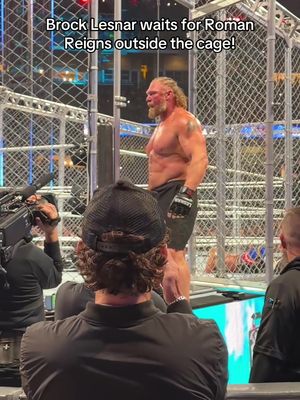 Brock Lesnar waits for Roman Reigns outside the cage! #WWE 