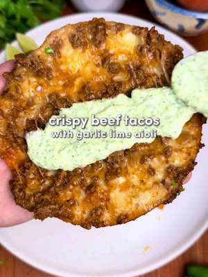 Crispy Beef Tacos with Garlic Lime Aioli 🌮 Minimal effort, maximum flavor… crispy, juicy tacos with melty cheese and the most addictive aioli 🫰 Ingredients: -1 lb ground beef (I use 80/20) -1 yellow onion, diced -6 garlic cloves, minced -2 tbsp tomato paste -1/2 cup beef stock -1 tbsp pure avocado oil from @Primal Kitchen Foods  Homemade Taco Seasoning (or use store-bought 😵‍💫): -1 tbsp cumin -1 tbsp chili powder -2 tsp paprika -2 tsp oregano -2 tsp garlic powder -2 tsp black pepper -1 tsp cayenne (optional) Addictive Garlic Lime Aioli: -1/2 cup sour cream -1/2 cup mayonnaise -1 small jalapeño, deseeded (optional) -1 1/2 cups cilantro (leaves + stems) -4–5 garlic cloves -2 tsp black pepper -1 tsp salt -Juice of 1 lime For Assembly:  -10 to 12 mini tortillas -2 cups shredded mozzarella -Primal Kitchen’s pure avocado oil for frying Instructions: 1. In a small bowl, whisk together the homemade taco seasoning spices to create a blend. 2. Heat 1 tbsp avocado oil in a large pan over medium heat. Add the diced onion and sauté until soft and fragrant, about 3–4 minutes. Add the minced garlic and cook for another 30 seconds. Add the ground beef and break it up. Cook until mostly browned. Add the taco seasoning (or 2 to 3 tbsp store-bought) and tomato paste, mix well, and sauté for 2–3 minutes. Pour in the beef stock and cook for 8–10 minutes, or until the liquid evaporates and the beef is saucy and fully cooked. Set aside. 3. In a blender or food processor add all of the aioli ingredients. Blend until smooth and green and dangerously addictive.  4. Lay a tortilla flat. Add a thin layer of mozzarella, 2–3 tbsp of the beef filling, then another sprinkle of cheese. Fold it over. Repeat until you’ve built a small army of tacos. 5. Heat a light layer of avocado oil in a pan over medium-low heat. Add the folded tacos and cook until golden and crispy on both sides, adding more oil as needed. Work in batches so they crisp. 6. Plate them up, drown them in the garlic lime aioli, add extra cilantro if you’re feeling fancy, and enjoy the crunch. #DinnerIdeas #cooking #cookingathometiktoktv #easydinner 