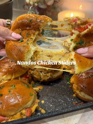 NANDOS CHICKEN SLIDERS This was SO good & literally the quickest dinner ever to make, genuinely less than 20 minutes 🙌🏼 Follow @kimberlys for more recipes like this⤵️ For the chicken   - 300g chicken breast  - 1 small diced onion  - Half a diced pepper   - 1 packet Nandos peri rub    - 80g Philadelphia light  - Tbsp Nandos peri peri medium  To serve/toppings: - 6 brioche rolls  - 6 Mozzarella slices  - 40g grated mozzarella The garlic butter:  - 20g butter  - Tsp parsley  Dice the chicken & mix with the rub, then fry this in a pan, once it has some colour add in the onion and pepper, cook for 5-6 minutes until the veg has softened and the chicken is cooked through.  Add the Nandos sauce and Philadelphia to the chicken and stir well. Layer the bottom of the brioche rolls in a baking dish, top with mozzarella slices, then the chicken mix and sprinkle over the grated mozzarella. Add the tops of the bread rolls, then lather over the garlic butter and pop in the oven for the cheese to melt and go all gooey. Around 10 minutes in total.  #quickdinners #fyp  #chickensliders #periperichicken #nandossliders    