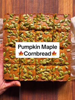 Here's how to make Pumpkin Maple Cornbread: • ½ cup plus 2 tablespoons unsalted butter (1¼ stick), melted and cooled slightly, plus more for greasing the pan • 1 cup finely ground yellow cornmeal • 1 cup all-purpose flour • 1 teaspoon baking powder • ¾ teaspoon kosher salt • ½ teaspoon baking soda • 1 large egg • ¾ cup packed light or dark brown sugar • 1 cup canned pumpkin purée • ½ cup buttermilk • ½ cup plus 2 tablespoons maple syrup • ¼ cup pumpkin seeds (pepitas) Heat the oven to 375 degrees. Butter an 8-inch square baking pan. Line with parchment paper, leaving a 2-inch overhang on two sides. Butter the parchment. In a medium bowl, whisk together the cornmeal, flour, baking powder, salt and baking soda. In a large bowl, whisk together ½ cup melted butter, the egg, brown sugar, pumpkin purée, buttermilk and ½ cup maple syrup. Fold in the dry ingredients. Transfer the batter to the prepared pan, and smooth out the top. Top evenly with the pumpkin seeds. Bake until a toothpick inserted into the center comes out with moist crumbs attached, 25 to 30 minutes. Meanwhile, combine the remaining 2 tablespoons of melted butter and the remaining 2 tablespoons maple syrup. Transfer bread in the pan to a wire rack. While the bread is still warm, brush the entire surface with the butter-maple mixture. Remove the cornbread from the pan using the overhanging parchment, and cut cornbread into pieces. Serve warm or at room temperature.