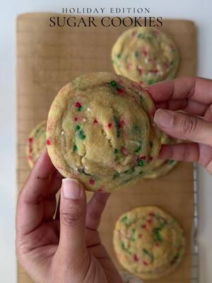 Holiday edition sugar cookies 🍪  Ingredients  2 cup (240g) all purpose flour  1 tbsp corn starch  1/3 tsp salt 1/2 tsp baking soda 2 tsp vanilla bean paste or vanilla extract  1/4 cup (50g) light brown sugar 3/4 cup (150g) granulated sugar 1 egg + 1 egg yolk , room temp 1/4 cup sprinkles 3/4 cup (170g) unsalted butter, melted  4 tbsp granulated sugar , for rolling  Method: In a bowl add butter, granulated sugar and brown sugar. Mix well to combine for 1-2 min. Crack in the egg and add the egg yolk. Whisk for 2-3 min until smooth paste forms. Add in the vanilla bean paste and mix to combine. In a separate bowl add all purpose flour, cornstarch, baking soda, salt. Mix to combine . Gradually add the dry ingredients to the wet batter and mix until just combined. Then, add the sprinkles and mix until they’re evenly distributed. Be careful not to overmix the batter.  Scoop 12 cookies onto a piece of parchment paper and roll them in granulated sugar. Freeze them for 30 minutes. Preheat the oven to 350°F. Place 4 cookies onto one baking sheet, spacing them evenly.  Bake for 13-14 minutes. Let them cool completely before serving and enjoy. #sugarcookies #recipes #baking 