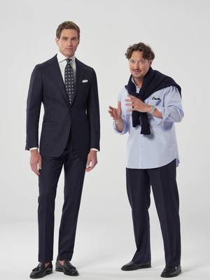 Formal wedding coming up? Start with a proper navy suit. Our style director Marc, styles it with a crisp white shirt, tie, and cufflinks for a look that feels festive and refined. Discover it in-store & online.