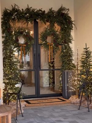 The dreamiest holiday porch—twinkle trees glowing each night, oversized bronze reindeer, and lit pine trees with built-in timers (a lifesaver during the busy season)!  📹: @homewithchrissym #mypotterybarn
