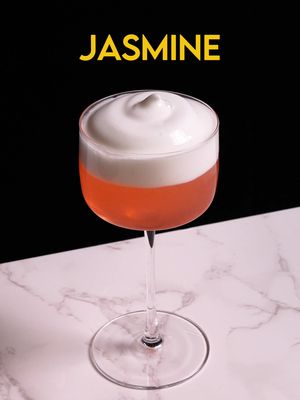 Jasmine Gin, Orange Liqueur, Campari, Lemon, Jasmine Foam The Jasmine is one of the early modern classics created by Paul Harrington for a regular named Matt Jasmine. Built on the bones of a Pegu Club but brightened with Campari, it became a bartender favorite for its pink, citrusy bitterness almost like a grapefruit.  A bit of a missed opportunity for a cocktail called Jasmine to not have Jasmine in it, so we’re going to riff on it by adding a jasmine foam. 1.5 oz gin 0.75 oz lemon juice .25 oz orange liqueur, such as cointreau .25 oz red aperitif, such as campari 3 drops saline 1:4 water:salt top with Jasmine Foam Shake with ice, strain into a coupe. Top with Jasmine Foam Jasmine Tea Foam 300 ml water 5 g jasmine pearls 30 g sugar 1.5 g citric acid 1.8 g methocellulose 50 0.5 g xanthan gum 1 N2O charge (I know I said NO2 in the VO its actually N2O) Steep jasmine pearls in hot water, covered for 10 minutes, then add sugar and acids. Stir to combine, then sift in methocellulose 50 and xanthan gum. Blend, then pour into a cream whipper and charge with two n2O charges, shaking in between charges. Store in the fridge for at least 2 hours before using. Sorry my methocel 50 is almost at its best by date and I need to use it all! Foam cocktails for everyone!! #fyp #cocktails #gin #jasmine