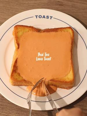 🍞🫖 Thai Tea Lava Toast 📝 Recipe Thai Tea 🫖: 3 tbsp • Thai Tea Leaves 40g • Sugar 200ml • Milk 100ml • Water Thai Tea Cream 🥛: 30g • Thai Tea 50g • Whipping Cream 2 Slices • Bread 10g • Sweetened Condensed Milk 1 Egg 30g • Milk 1 tbsp • Butter Instructions: • Thai Tea - put thai tea leaves and sugar on a pot - turn on the stove at medium heat, stir the tea leafs - pour milk and water then stir - wait until the tea simmer and stir again *note: I made a big portion to make another 3 drinks • Thai Tea Cream - pour thai milk tea and whipping cream - mix with hand mixer / milk frother until creamy • Spread & Bread - spread condensed milk on bread and stack another bread on top • Soaking; Bread - prepare a bowl - crack open 1 egg, pour milk, and whisk - dip the bread in the egg mixture • Cooking; Bread - melt butter on a pan in medium heat - cook the bread and flip the bread until both sides are cooked / golden brown • Finishing; Thai Tea Lava Toast - flatten french toast in the middle to make space for the thai tea cream - pour the thai tea cream and enjoy! — #homecafe #breadrecipe #asmr #toast #EasyRecipe 