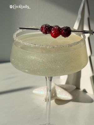 Add a bit of sparkle to your holiday season with this winter wonderland cosmopolitan ✨❄️ -2 oz. vodka -1 oz. triple sec -1.5 oz. white cranberry juice -1/2 oz. lime juice -coarse sugar & lime for rim -sugared cranberries #cosmo #christmas #christmascocktails #vodka #holidaycocktails