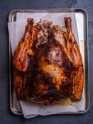 Turkey only happens once a year… which is why it stresses everyone out. This time I tried something a bit different: compound butter under the skin. Does it actually keep the breast juicy? You’ll see. I used @MEATER probes so I could track the breast and thigh separately and let the oven do its thing. THE RECIPE Brine 3L water 72g salt 5g bicarb 1 lemon 10 garlic cloves Bay, rosemary, thyme Simmer 1 min → cool fully → turkey in overnight. Pat dry. Keep herbs & lemon for stuffing. Compound Butter 375g butter 2 tbsp olive oil 150g dried cranberries Zest of 1 orange 3 garlic cloves Salt & pepper Mix. Loosen skin with a spatula and push the butter underneath. Roast 2 onions Olive oil Giblets Stuff turkey with onions + saved aromatics. Oil the skin. Cook 10 min at 220°C. Add bacon over the breast → drop to 180°C and roast until breast + thigh hit your target temps. Rest 1 hour. Gravy Flour 150ml dry white wine 250ml stock 2 tsp red wine vinegar Skim fat, add aromatics + bacon, cook flour until golden. Deglaze with wine → reduce → add stock → reduce again. Strain. Season. #MEATER #MEATERMADE #HowToTurkey #RoastItRight #CookToTemperature AD