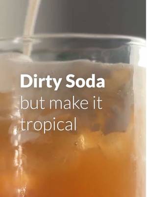 This is what happens when your dirty soda takes a tropical vacation 🌴 Recipe below! 6 oz Dole® Light Pineapple Juice Drink 4 oz Cream Soda 1 oz Coconut Cream ½ oz Brown Sugar Syrup Crushed ice Let us know what you think! #dole #dirtysoda #pineapplejuicerecipe