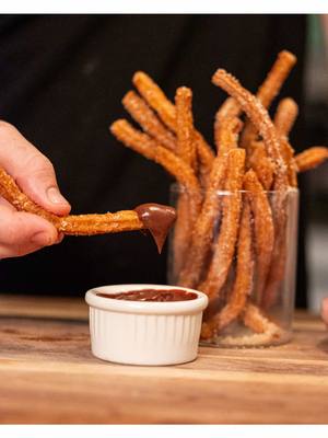 Some of you like your churros thick, I like mine thin and crispy. The only difference between the two is the size of the star tip on your piping bag. Choose the big tip for chewier churros, and the small for thin and crunchy. These churros are made with @Organic Valley butter, then dipped in a spicy chocolate ganache made with their heavy cream which is a dream. What’s your churros style? Full recipe is on my website BenGingi.com YASSS!