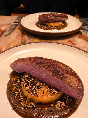 🔥 One of our favorite tasting menus in Houston is also the most affordable. At Maximo — the progressive Mexican canteen from Benjy Levit and Dylan Murphy’s Local Foods Group in West University Place — chef Adrian Torres delivers a confident, thoughtful progression of dishes that showcases the refined skill, creativity and sense of place that earned the restaurant a Bib Gourmand award in the 2025 Michelin Guide Texas selection. 🏅 The chef's tasting menu delivers five courses for just $45 per person and is available Wednesday through Sunday from 4 to 9 p.m. Full table participation is required and beverage pairings are available for $30. We highly recommend the experience! 🍣 A bluefin tostada whets the appetite with bright avocado, chili crisp and chapulines, followed by an enchilada potosina layered with queso de cincho and crema casera. 🌽 The signature masa cornbread with chicatana butter and Alaskan paddlefish caviar adds a rich, buttery turn before duck with mole negro brings a deep, steady finish and Torres' iconic buñuelo with vanilla custard and banana ice cream closes the night on a whinsical note. 🍌 🥃 Beverage director Mark Sayre’s cocktails rise to the occasion with complexity and easygoing hospitality that makes the room feel like home. The Clara, a clarified cocktail of mezcal, mint, pineapple and lime, was one of my favorite new cocktails of the year. 🥟 Our degustation included à la carte bites, Molote de Suadero and a colorful Shrimp Flauta, to elevate an already outstanding meal. 📍 @VivaMaximoHouston ✍️ @MadmanMario