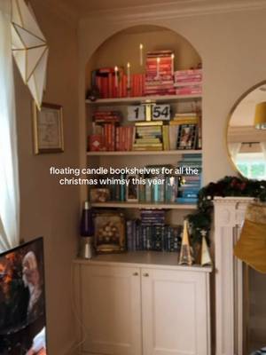 one thing about me, if i can possibly add another twinkling light, i will 🕯️ #christmasdecor #floatingcandles #bookshelf #bookish #cozylittlechristmas 
