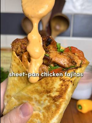 Sheet-Pan Chicken Fajitas with Roasted Garlic Chipotle Sauce 🔥 All the flavor, one pan… juicy spiced chicken loaded with garlicky goodness 🧄 Chicken marinade -2 lb (0.8 kg) boneless skinless chicken thighs, sliced -3 tbsp mayonnaise -2 tbsp @primalkitchenfoods avocado oil -2 tbsp honey + Juice of 1 lime -7 garlic cloves, minced -Seasonings: 2 tsp paprika, 1 tbsp chili powder, 1 tbsp cumin, 1 tsp cayenne (optional), 2 tsp oregano, 2 tsp onion powder, 2 tsp garlic powder, 2 tsp salt & 2 tsp  pepper Veggies: -1/2 red onion, sliced -1/2 each of a red, yellow, orange and green bell pepper, sliced -2 tbsp avocado oil -Veggie seasonings (1 tsp each): garlic powder, cumin, chili powder, paprika, oregano, onion powder, salt, pepper For the Roasted garlic: -1 head of garlic, top 1/4 sliced off + 1 tbsp oil of choice + 1 tsp salt Roasted garlic chipotle sauce: -1/2 cup sour cream + 1/4 cup mayonnaise -Roasted garlic (the whole head) -2 chipotle pepper + 1 tbsp honey + Juice of 1/2 lime 1. Add the sliced chicken to a bowl with mayo, avocado oil, honey, lime juice, garlic, and all chicken seasonings. Toss until everything is coated. Marinate for at least a few mins, or up to overnight. Longer = better flavor. 2. Preheat oven to 425°F (220°C). Drizzle the garlic head with oil and salt, wrap it in foil like a little flavor gift, and place on a tray. Roast for 45–60 minutes, until soft & golden. 3. Add all sliced veggies to a large sheet pan. Drizzle with avocado oil, sprinkle with veggie seasonings, and toss to coat. Add the marinated chicken directly onto the pan with the veggies. Toss everything together so it plays nice. Bake for 20–25 minutes, until the chicken is fully cooked, lightly charred, and the veggies are tender. 4. Once the garlic is cool, squeeze the roasted cloves into a blender or food processor. Add sour cream, mayo, chipotle peppers, honey, and lime juice. Blend until smooth. 5. Spoon pan juices back over the chicken. Top with cilantro, extra lime, and dollops of the chipotle sauce. I love turning this into wraps. Load up tortillas and crisp them in a buttered pan. #dinner #recipesoftiktok #Recipe 