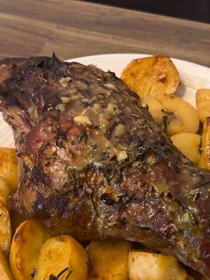 This roast is staying on repeat 🤩🥔 @taylor sakellis | food & fun ✨  RECIPE:  1 bone in leg of lamb 3 cloves of garlic, thinly sliced 1 Tbsp dried oregano 1 sprig of fresh rosemary 2 Tbsp sea salt 2 Tbsp dijon mustard 1 lemon, juiced 2 cups of chicken broth 2 Tbsp extra virgin olive oil 2 pounds of baking potatoes, peeled and sliced Salt, to taste Instructions: In a large roasting pan, pat the lamb leg dry and use a paring knife to make small slits throughout the lamb. Drizzle the lamb with 1 Tbsp olive oil, then place the garlic slices into the incisions. Sprinkle both sides of the leg with 1 Tbsp sea salt, then, in a separate bowl, combine the dried oregano, rosemary, 1 Tbsp of dijon mustard and half of the lemon juice. Coat the lamb with this mixture, then add potatoes to the pan. Mix in the remaining olive oil, dijon mustard, sea salt and lemon juice into the chicken broth and pour over the potatoes. Roast at 375° until the lamb reaches medium rare, around 145°. The good news is it’s a lean cut of meat, so it won’t take hours to roast! Remove the lamb from the roasting tray to allow it to rest, then turn up the oven heat to 450° and continue to cook potatoes until they’re golden and have absorbed most of the chicken broth. This usually takes an additional 20 to 30 minutes, but keep an eye on them. Allow the lamb to rest for at least 30 minutes before serving, and be sure to spoon any remaining broth on top of the lamb and potatoes. Enjoy!