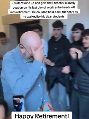 TEARS: Students line up and give their teacher a lovely ovation on his last day of work as he heads off into retirement. He's taught at the school since 1989 a d couldn't hold back the tears as he walked by his dear students.