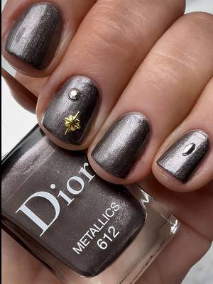 Replying to @AfrayCeramics Nail Journey: Episode 5 - testing the longevity of regular nail polishes. Today up on the chopping block is @Diorbeauty 🩶 this shade has me in a chokehold! And it would’ve lasted longer if I didn’t remove it due to the gems coming off. ALSO USED: • @Sally Hansen cuticle remover • @Olive & June gems, cuticle serum & pusher #maryamnyc #nailpolish #luxurynails