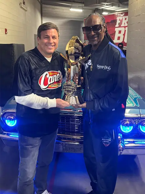 @Snoop Dogg and Todd Graves out at the Snoop Dogg Arizona Bowl presenting the Team and MVP trophies 🏆  Dogg rolled up on the field in this ‘63 Impala to present Fresno State the trophy.  Graves presented EJ Warner the MVP award.