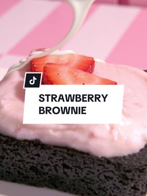 Our new Strawberry Brownie is here! 🍓🤎 A fudge brownie infused with freeze-dried strawberry pieces, crowned with strawberry cream cheese frosting, fresh strawberry slices, and a white drizzle. Who's excited to dig in? 👀 #Crumbl
