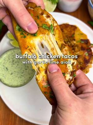 Buffalo Chicken Crispy Tacos 🔥 Crispy, saucy buffalo chicken tacos with a creamy garlic lime aioli that you’ll want to dunk everything in 🌮 Lately I’ve been using @Primal Kitchen Foods pure avocado oil to get that golden, high-heat sear. It’s neutral in flavor and perfect for cooking without burning. Now available at Walmart. #PrimalKitchenPartner #primalkitchen Ingredients For the Chicken: -1.5 lb boneless, skinless chicken thighs, very finely diced -Seasonings: 1 tbsp garlic powder, 1 tbsp onion powder, 1 tbsp paprika, 1 tsp salt, 2 tsp black pepper -3 tbsp avocado oil (divided) from Primal Kitchen -2 tbsp honey -2/3 cup Primal Kitchen’s buffalo sauce -1/4 cup fresh cilantro or parsley, finely chopped Addictive Garlic Lime Sauce: -1/2 cup sour cream -1/2 cup mayonnaise -1 small jalapeño, deseeded (optional) -1 1/2 cups cilantro, leaves and stems -4 to 5 garlic cloves -2 tsp black pepper -1 tsp salt -Juice of 1 lime For Assembly: -10 to 12 mini tortillas -2 cups shredded mozzarella -Avocado oil, for frying  Instructions: 1. Add the diced chicken to a large bowl with all the seasonings and 1 tbsp avocado oil. Mix until every piece is coated. 2. Heat the remaining 2 tbsp avocado oil in a large pan over medium-high heat. Add the chicken and cook, stirring occasionally, until  golden and crispy, about 8 minutes. Remove from heat and add-in buffalo sauce, honey, and cilantro. Mix together. 3. Add all sauce ingredients to a blender or food processor. Blend until smooth, bright green, and very hard not to taste repeatedly. 4. Lay a tortilla flat. Sprinkle a thin layer of mozzarella, add 2 to 3 tbsp buffalo chicken, then another light sprinkle of cheese. Fold in half. Repeat until all tacos are built. 5. Heat a thin layer of avocado oil in a pan over medium-low heat. Cook tacos in batches until golden and crispy on both sides, adding more oil as needed. 6. Serve hot, generously drizzle with garlic lime aioli, add extra cilantro if you like, and enjoy the crunch. Dunk responsibly.