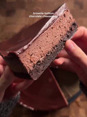 brownie bottom chocolate cheesecake brownie: 2 eggs 1/2 cup (42g) cocoa powder 1/2 tsp (3g) each salt, baking powder 1 1/2 tsp (6g) vanilla 1/2 cup (113g) unsalted butter (melted) 1 cup (200g) sugar 3/4 cup (90g) flour 1/4 cup (43g) chocolate chips (optional) *microwave butter and sugar gradually until sugar dissolves and is shiny. set aside. in another bowl, mix together eggs, cocoa, salt, baking powder, and vanilla. combine the egg and butter mixtures well, then mix flour, then the chocolate chips if you want. pour into a 9 inch spring form pan and bake at 350 for 15 min. take out of oven and turn oven temp down to 325. cheesecake: 16 oz (454g) cream cheese, room temp ⅔ cup (133g) sugar 1 tbsp (8g) flour 2 tsp (8g) vanilla 1/2 tsp (2g) salt 2 tbsp + 2 tsp (13g) cocoa powder 5 oz (142g) semi-sweet chocolate ¼ cup (60g) sour cream 2 tbsp (30g) heavy cream 2 eggs, room temp *melt the chocolate gradually in the microwave, and then set aside to cool a bit. in a big bowl, cream together cream cheese and sugar until smooth. add in the flour, salt, and cocoa powder until smooth. pour in and mix the melted chocolate. then gently mix in the sour cream, heavy cream, and vanilla. once all mixed, gently mix in the eggs one at a time. pour into the half-baked brownie bottom and bake for bake for 45-50 min. then turn off the oven and let it rest for 20 min, then crack the oven door open a bit and let cool 30 min. cool to room temp after and then into the fridge. optional: top with chocolate ganache (melted chocolate + heavy cream mixed) #chocolate #cheesecake #brownies #Recipe 