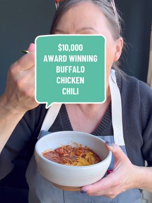 This $10,000 award-winning buffalo chicken chili has been winning chili cook-offs for 16 years now 🤯 and I don’t mean one or two. We’re talking hundreds… maybe even thousands of wins since I first posted it. It’s bold, cozy, a little spicy, and somehow still light enough to fit into real life eating. Fun fact: I don’t like onions, so there are none in my version — but if you’re an onion lover, feel free to add them in and make it your own. And let’s talk numbers because this one is chef’s kiss: ✨ 1 Weight Watchers point per 1-cup serving ✨ 165 calories ✨ 2g fat | 16g carbs | 5g fiber | 17g protein This is one of those recipes that proves comfort food and balance can absolutely coexist.  Ingredients 1 tablespoon olive oil 2 pounds boneless, skinless chicken breasts 2 large carrots 3 stalks celery 1 large red pepper 5 cloves of garlic 5 tablespoons of chili powder 2 tablespoons ground cumin 1 tablespoon paprika 1/2 cup Frank’s Hot Sauce 2 (15 oz) cans tomato sauce 1 (15 oz) diced tomatoes 1 (15 oz) black beans, drained 1 (15 oz) chili beans in sauce (do not drain) salt and pepper to taste Instructions Put chicken breasts in food processor to grind up, if you can find ground chicken breast, you can use that too.  Heat oil and add ground chicken and cook about 10 minutes on medium heat until no longer pink.   Rinse out processor and add carrots, celery, garlic and red pepper and puree.  Add to chicken mixture and cook about 5 minutes until veggies start to soften. Next add the rest of the ingredients, put stove on simmer and cook for 1 hour. #awardwinning #Recipe #chilirecipe