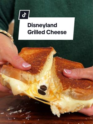 Just loooook at the cheese pull! 🤤🧀  For one of the best grilled cheese recipes you'll ever try—straight from Disneyland—layer provolone and Cheddar slices with a  Cheddar and cream cheese spread on hearty white bread. 🏰✨ Keep reading to get the full copycat recipe or click the link in the @allrecipes bio!  Ingredients:  4 ounces cream cheese, softened 2/3 cup shredded sharp Cheddar cheese 1 1/2 tablespoons heavy cream 1/2 teaspoon kosher salt, divided 1/2 cup mayonnaise 2 cloves garlic, finely minced 8 slices hearty white bread 8 slices sharp Cheddar cheese 8 slices provolone cheese Directions: 1. Stir cream cheese, shredded cheese, heavy cream, and 1/4 teaspoon salt together in a small bowl until well combined; set aside. 2. Stir mayonnaise, garlic, and remaining salt together in a separate bowl; set aside.  3. Place 2 slices Cheddar cheese on each of 4 pieces of bread. Spread cream cheese mixture evenly among the 4 Cheddar-topped slices; top each with 2 slices provolone cheese. Add remaining bread slices on top. 4. Spread half of mayonnaise mixture evenly over tops of sandwiches. 5. Heat a large nonstick skillet over medium heat. Place sandwiches in skillet, mayonnaise side down. Spread the top of each sandwich with remaining mayonnaise  mixture. 6. Cook sandwiches until golden brown on both sides, flipping occasionally until cheese is melted and bread is well toasted. ✨ Inspo: @/stefantorres on IG 🧑‍🍳: @NicoleMcLaughlin  #grilledcheese #copycatrecipes #disneyland #disneylandfood #disneysnacks   