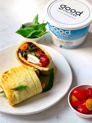 no flatbread? no problem. Italian Style Cottage Cheese Flatbread Wrap Ingredients: Italian Style Cottage Cheese Flatbread • 1 cup of 2% Simply Good Culture Cottage Cheese • 2 eggs • Salt to taste • ½ tsp garlic powder • ½ tsp Italian seasoning Wrap Filling • 1 tsp Calabrian Chili paste • Mozzarella slices • Grape Tomatoes, sliced • Fresh Basil Leaves • Bell Peppers, sliced • Microgreens Method: 1. Preheat the oven to 350°F. Grease and line a 1/8th baking pan with parchment and set aside. 2. Blitz all the flatbread ingredients in a blender or food processor until ultra-smooth. 3. Pour the flatbread batter into the prepared pan. Bake for about 20 minutes or just until the flatbread begins to brown and is no longer jiggly in the pan. 4. Pull the flatbread out, letting it cool for a few minutes. 5. Pull the flatbread off the parchment gently and place on a clean surface to assemble the wrap. 6. Arrange the wrap fillings to your liking and gently fold the flatbread until you have a burrito-like shape. 7. You can wrap this in parchment and slice for the perfect to go wrap or slice and enjoy right away.