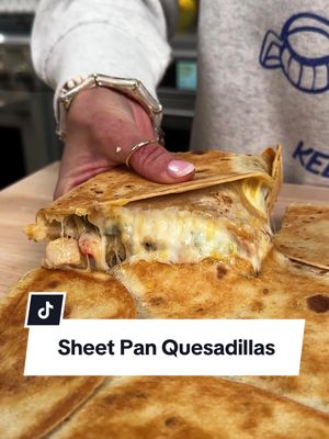 Sheet Pan Quesadillas are your next one-pan wonder! 🌮 Bonus tip: baking them under a second sheet helps the stuffed tortillas turn golden and crisp on the outside, with melted cheesy goodness inside. 🤤 Get the full recipe details in the link in @allrecipes bio!  Ingredients:  1 tablespoon olive oil 1 onion, chopped 1 green bell pepper, chopped 1 red bell pepper, chopped 1 pound skinless, boneless chicken breast, chopped 2 tablespoons water 1 (1.1-ounce) package fajita seasoning mix 8 (8-inch) flour tortillas 2 cups shredded Mexican cheese blend 4 tablespoons sour cream, for serving 4 tablespoons pico de gallo, or to taste 2 tablespoons chopped fresh cilantro, for garnish* (*Nicole doubled the ingredients to serve more from a bigger sheet pan) 🧑‍🍳: Nicole @nicolesperfectbite #quesadillas #easydinners #sheetpandinners #sheetpanrecipes #EasyRecipes 