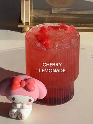 cherry lemonade for my melody 🍒🍋🌟 my mel turns 51 today! 🥳 here’s a fun lil drink that inspired by her signature red hood ❣️ recipe: 〰️cherry jam 〰️ice 〰️cotton candy 〰️cherry lemonade #homecafe #aestheticdrinks #sanrio #icedtea #refresher  