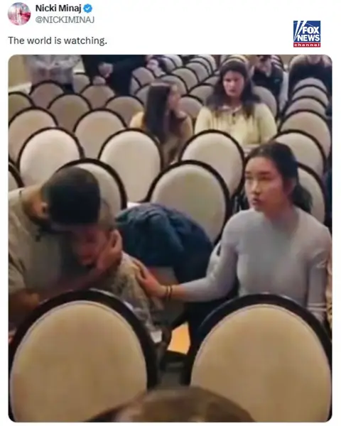 Rapper Nicki Minaj shares a photo online of what appears to be a father holding his crying son as anti-ICE agitators stormed a Minnesota church during Sunday service. She captioned the image, which has been getting a lot of attention online, "The world is watching." The star also posted about Don Lemon, a former CNN anchor who chronicled the church demonstration on social media: "I WANT THAT THUG IN JAIL!!!!! HE WOULD NEVER DO THAT TO ANY OTHER RELIGION. LOCK HIM UP!!!!!"