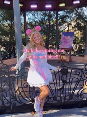 For Epcot international festival of the arts!! Always the most fun!!! 🩵🩷 this is actually the same dress from last year!! I just thought it needed a little more paint! I mixed the paint with water so it would be easier to splatter and it was so cold!!! 🙈 I loveeee how it turned out!! And goes perfectly with my Aurora ears!! #disneybound #disneymom #princessaurora 