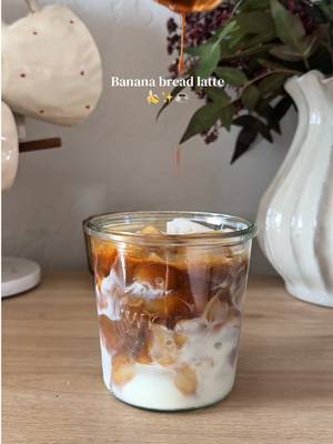 Banana bread latte🍌✨🤎☕️ Syrup recipe: - 2 bananas  - 1/2c brown sugar  - 1/2c sugar  - 1 cup water  - 2 tbsp cinnamon  - 1 tablespoon vanilla bean paste Add ingredients to a pot and let simmer for 10 minutes turn off heat then add your vanilla( store in the fridge for 2 weeks)✨ Banana bread latte recipe: -1 tbsp banana bread syrup  - double shot of espresso  - pinch of salt  - ice  - milk  - banana vanilla cold foam - top with cinnamon  Enjoy💛 #bananalatte #bananabread #coffee #homebarista #coffeerecipes 