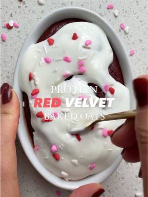 Protein Red Velvet Baked Oats ❤️‍🔥 MAKE THESE FOR YOUR HUNNAYYY (or yourself 👑 ) this Valentines Day.  I know I say this a lot but now THIS might be my favourite - I think I’m just a sucker for cream cheese icing tbh 🤷🏼‍♀️ INGREDIENTS YOU NEED -  FOR OATS 1/2 cup certified gluten-free quick oats (always @bobsredmill ) 1/2 tsp baking powder 1.5 tbsp cocoa powder 1 scoop chocolate protein powder 1/2 cup unsweetened almond milk 1 egg 1.5 tsp red food colouring FOR CREAM CHEESE ICING 1/4 cup plain greek yogurt 1.5 tbsp cream cheese 1 tbsp sugar-free powdered sugar  DIRECTIONS - 1) Blend your oats on high to create a fine oat flour. Then add all remaining dry ingredients and wet ingredients and blend till combined.  2) Pour into a greased oven safe baking dish and bake at 350F for 20-23 minutes.  3) While that’s baking, make the frosting by combining together the greek yogurt, cream cheese and powdered sugar in a small bowl.  4) Remove oats from oven and top with “frosting” and sprinkles. Enjoy your delicious baked oatmeal!  Tips/tricks & macros are always up on the blog! Search https://basicswithbails.com/popular/baked-oats/protein-red-velvet-baked-oats-gluten-free-recipe/ #bakedoatsrecipe #proteinbakedoats #highproteinbreakfast #redvelvetoats #redvelvettreats   