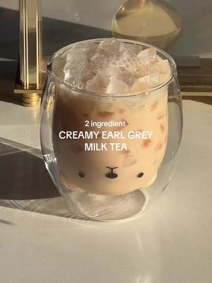 easy 2 ingredient: creamy earl grey! 🌟🧸 one of my favourite hacks to making creamy milk tea without any powders or milk! 👀 steep your fave tea & mix condensed milk - that’s it! it makes a strong milk tea, without watering it down with milk!  #tealatte #tealatte #earlgrey #homecafe #homebarista  