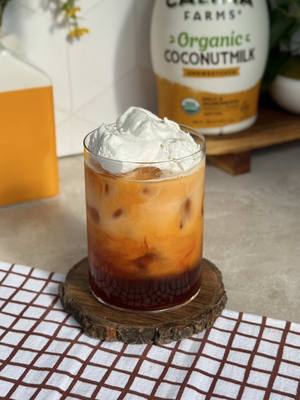 coconut thai tea with @Califia Farms Organic Coconutmilk! adds the perfect touch of coconut creaminess and balances out the boldness of the thai tea #CalifiaPartner 🥥 brew 1 tbsp thai tea leaves in 6 oz hot water and let it steep for 30 minutes 🥥 to a glass, add brown sugar syrup to taste 🥥 pour in 3 oz Califia Farms Organic Coconutmilk  🥥 top with scoops of coconut whip
