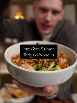 20 Minute Teriyaki Salmon Noodles FAKEAWAY🔥AD This is ideal for a quick dinner it’s full of protein, veg and flavour - absolutely bang on. Loads more recipes like this on the @PureGymOfficial app or blog! Serves: 2 Prep time: 10 mins Cook time: 20 mins Ingredients: 2 salmon fillets 3 tbsp teriyaki sauce 1 onion, diced 1 garlic clove, crushed 100g tender stem broccoli tips 1 carrot, peeled and cut into matchsticks 2 ramen noodle nests 1 spring onion, sliced 1/2 red chilli, sliced 1 tsp black sesame seeds Low-calorie oil spray Method: •⁠ ⁠Cut salmon fillet into chunks and pour over 2 tbsp of teriyaki sauce and mix well, leave to marinade for 30 minutes. •⁠ ⁠Cook ramen noodles as per packet instructions, drain and set aside. •⁠ ⁠Whilst the noodles are cooking, heat a frying pan with low-calorie oil spray and sauté onion and garlic for 2-3 minutes until softened. •⁠ ⁠Add broccoli and carrot and 1-2 tbsp water and fry off for a further 3-4 minutes until cooked. Remove and set aside. •⁠ ⁠Add salmon to the same pan and cook for 4-5 minutes until cooked through, remove and set aside with the vegetables. •⁠ ⁠Add noodles to the same pan and pour over remaining 1 tbsp teriyaki sauce, mix well. •⁠ ⁠Add salmon and vegetables back to the pan and gently combine until hot. •⁠ ⁠Served topped with spring onions, red chilli, and sesame seeds. #PureGym #FeelPureGymGood 