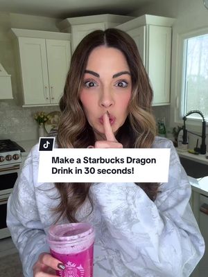 MAKE A STARBUCKS DRAGON DRINK IN 30 SECONDS!  Next time you get Starbucks, save the plastic cup! Recipe for this quick copycat is below! Ingredients  • 1/2 cup mango juice • 1/4 cup white grape juice • 1/4 cup coconut milk • 1/2 cup frozen dragonfruit Instructions 1. Add all ingredients to a cocktail shaker.  2. Pour over ice (pebbled ice to make it more like Starbucks!) #momlife #starbucks #copycat #Recipe #MomsofTikTok 