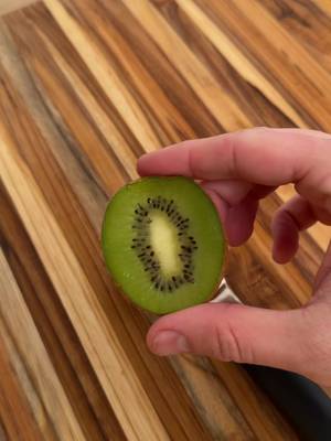 Pulling a shot of espresso through a kiwi