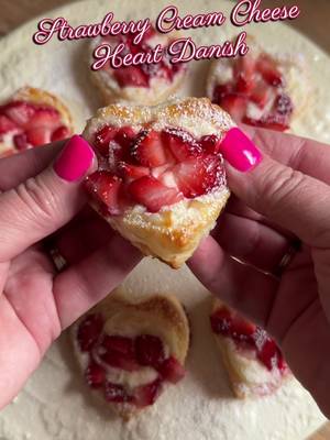 Strawberry Cream Cheese Heart Danish ❤️ The perfect Valentine’s Day treat, easy, flaky, and bakery-worthy. Using a heart-shaped cookie cutter cut puff pastry into hearts, then use a slightly smaller heart cutter to score a border about ¼ inch from the edge. Mix together 8oz. Cream cheese, a tsp. Vanilla and 1/2 cup powdered sugar. Pipe filling into center of heart and top with diced strawberries. brush edges with egg wash, and bake at 400°F for 10-12 minutes until golden. Finish with a light dusting of powdered sugar and enjoy warm ✨ #puffpastry #danish #strawberry #EasyRecipe 