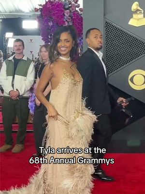 @TYLA just stepped onto the red carpet at the #Grammys ❤️‍🔥 Dripping in gold and feathers 😍.         Video: Hypebeast.                              #celebrity #redcarpet #Tyla #Grammys2026